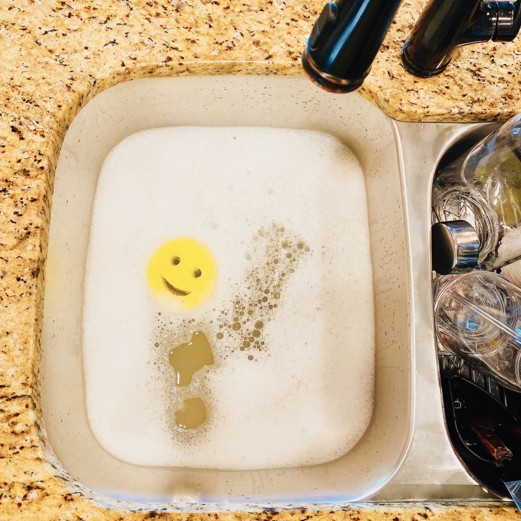 sink full of sudsy water with scrub daddy sponge