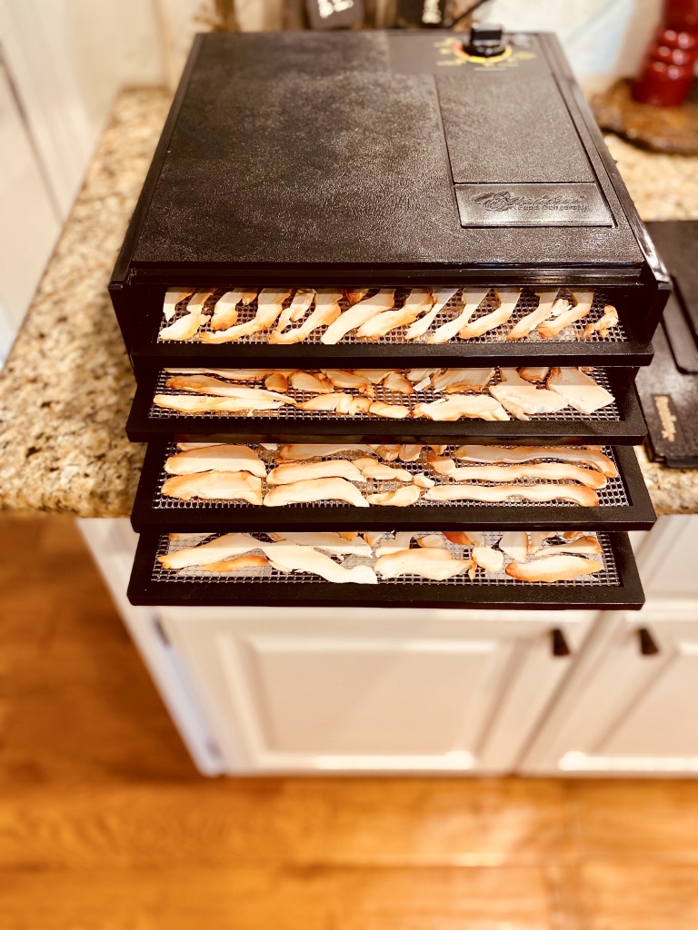 dehydrator with chicken of the woods mushrooms in it
